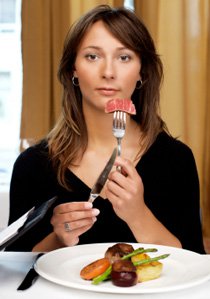 Woman Eating Meat